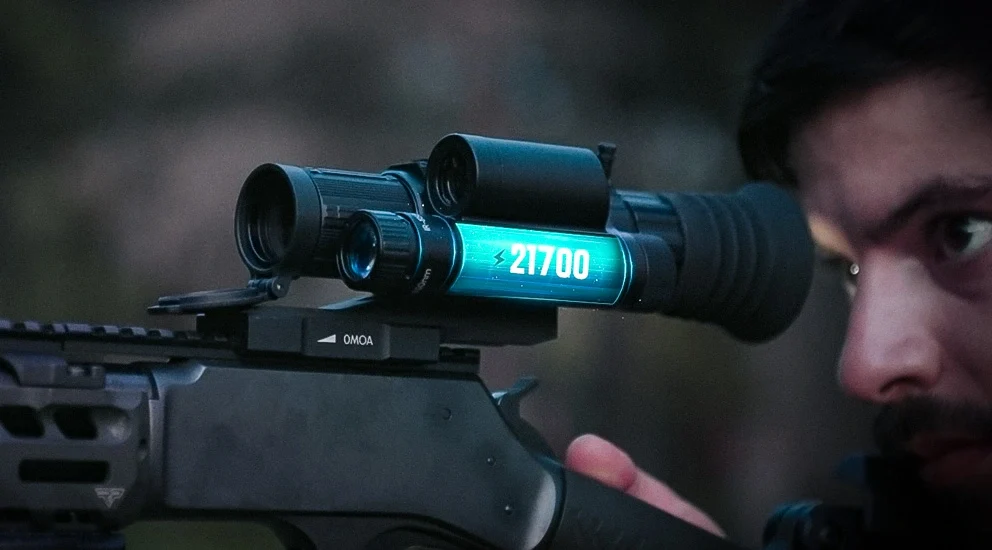 DNT Optics ZHD312R-V2 mounted on a rifle, close-up showing the 21700 battery