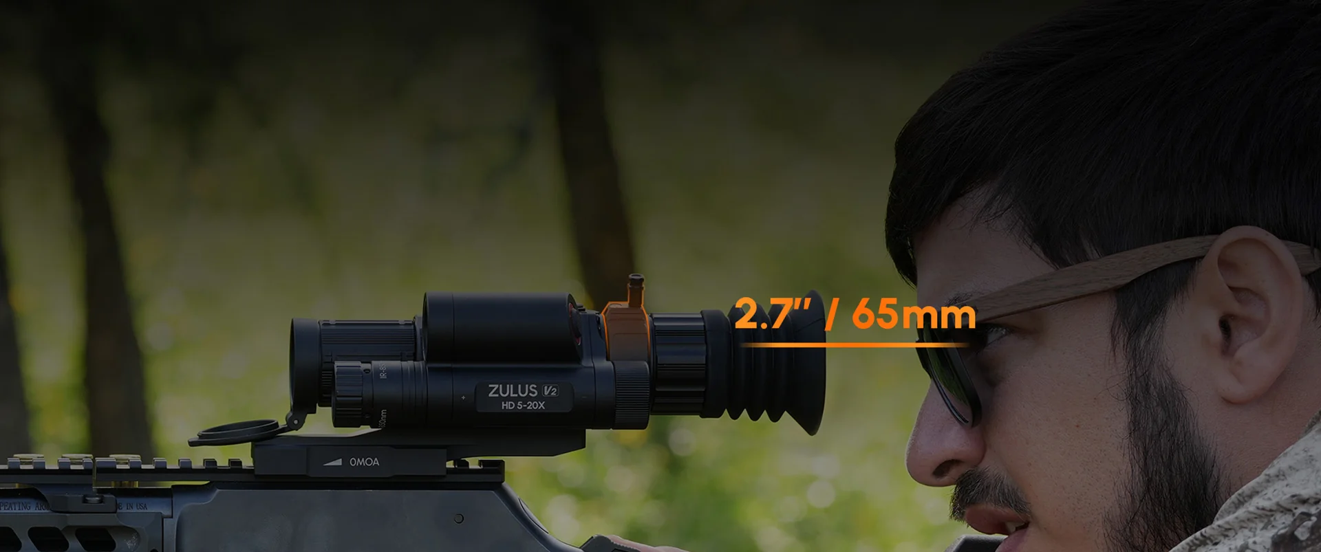 Shooter aiming a rifle mounted with a DNT Optics ZHD520R-V2 scope, 2.7 inch / 65mm eye relief callout